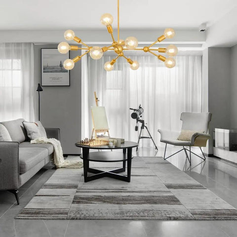 Modern Sputnik Chandelier 12 Light Gold Metal Ceiling Fixture for Living Room Bedroom Dining Kitchen and Office Dope Statement Lighting with E26 Base LED Compatible Bulbs Not Included 38.6 Inch Diameter in stylish living room setting