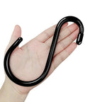 Hand holding a 12 Pack 6 Inch Heavy Duty S Hooks Vinyl Coated Non Slip Metal Hooks For Hanging Plants And More 7mm Thick Black Durable Closet Organizer