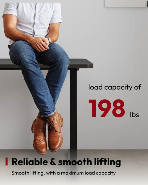 Person sitting at Heavy Duty Dual Motor Electric Standing Desk 71 By 32 showcasing load capacity of 198 lbs.