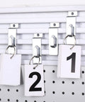50 Pack Slatwall Hooks Notch Hangers for Wall Displays Metal Pegboard Slat Grid Accessories shown holding numbered cards