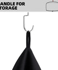 Close-up of a black Waterproof Pizza Oven Cover for Arc and Tread Models with a handle for storage on a hook, fabric visible.
