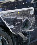Keep Your EV Port Dry As A Bone With This Hella Tough Magnetic Cover Featuring Waterproof All Season Shield Clear Fit For Steel Bodied Electric Rides In Clean White Finish, shown on a steel EV with water droplets.