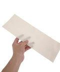 Hand holding Mica Paper Sheet 13x4 Inches Pro Grade High Temperature Flexible Insulation for heat guns and hot air blowers 20 pack