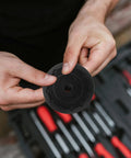 Hands holding a component of the Precision Machined Axle Nut Socket Set for Front and Rear Wheel Hubs Labor Saving Shaft Sleeve Wrench