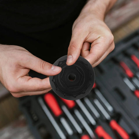 Hands holding a component of the Precision Machined Axle Nut Socket Set for Front and Rear Wheel Hubs Labor Saving Shaft Sleeve Wrench