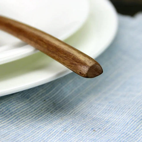 Close-up of a spoon from Six Piece Japanese Natural Wooden Spoons Set For Cooking And Eating Great For Stirring Tea Honey Soda Dessert And Nonstick Pots