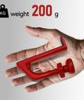 Hand holding Red Aluminum Alloy Portable Door Stopper With Diamond Anti Slip Base For Travel And Apartment Living Easy To Use Security Device That Locks Down Unauthorized Entry And Pry Attempts