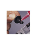 Loctite red high-strength threadlocker on a metal bolt, close-up view