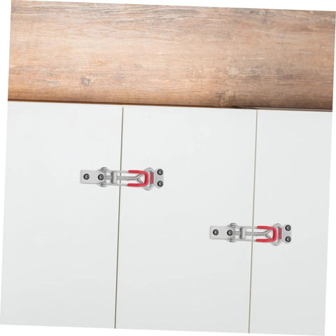 Heavy Duty Adjustable Toggle Clamp Latch With 360 Pound Capacity For Freezer Doors Cabinets Boxes And Tool Cases Built To Last And Keep Lids And Panels Secure In Busy Shops. Two galvanized iron toggle clamp latches on white cabinet doors
