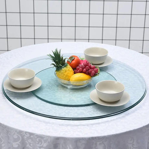Large Round Lazy Susan Turntable Glides Smooth As Butter Dual Plate Connection Heavy Duty Tempered Glass Serving Tray with fruit and bowls.