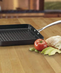 GreenGourmet 11-Inch Square Grill Pan With Hard Anodized Aluminum Nonstick Ceramic Coating PTFE PFOA Free on wooden counter