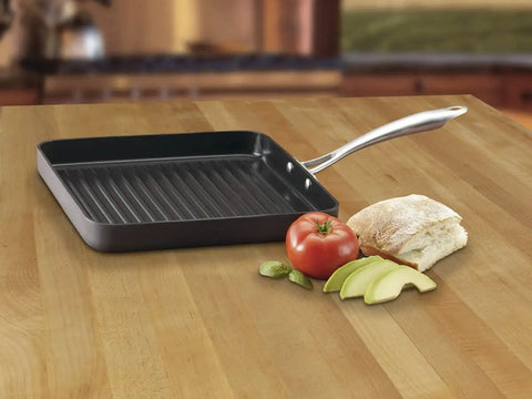 GreenGourmet 11-Inch Square Grill Pan With Hard Anodized Aluminum Nonstick Ceramic Coating PTFE PFOA Free on wooden counter