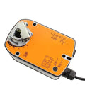 Top Shelf Rotary Actuator delivering a rock solid 4 Nm output for HVAC damper control, showing orange top and wiring.
