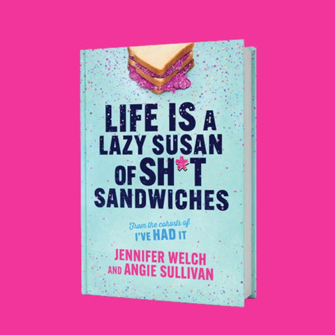 Book cover of 'Life Is A Lazy Susan Of Sh*t Sandwiches' by Jennifer Welch and Angie Sullivan against a pink background.