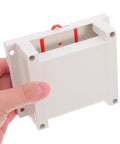 Person holding Weatherproof Outdoor Electrical Junction Box In Gray Flame Retardant ABS Plastic Industrial Enclosure.
