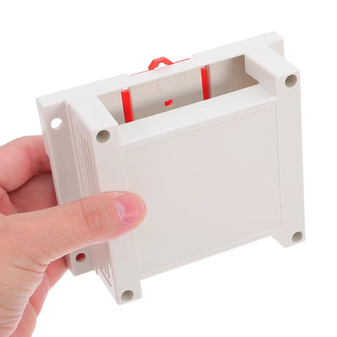 Person holding Weatherproof Outdoor Electrical Junction Box In Gray Flame Retardant ABS Plastic Industrial Enclosure.