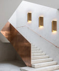 ZEROUNO Modern LED Wall Sconce Indoor Wall Lights Set of 2, Bronze hardwired lamps illuminating a modern staircase.