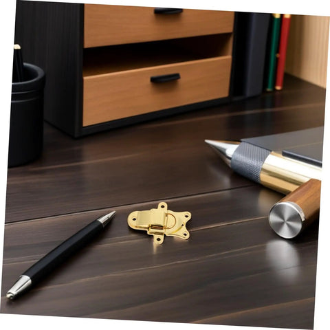 Classic Antique Golden Toggle Latch Zinc Alloy Duckbilled Hasp Lock For Toolbox Guitar Case Jewelry Box with black pen on desk.