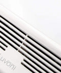 Close-up of white grill of Super Quiet 90 CFM Bathroom Exhaust Fan With Built In LED Light, Ceiling Mounted Vent, 4 Inch Duct Compatible