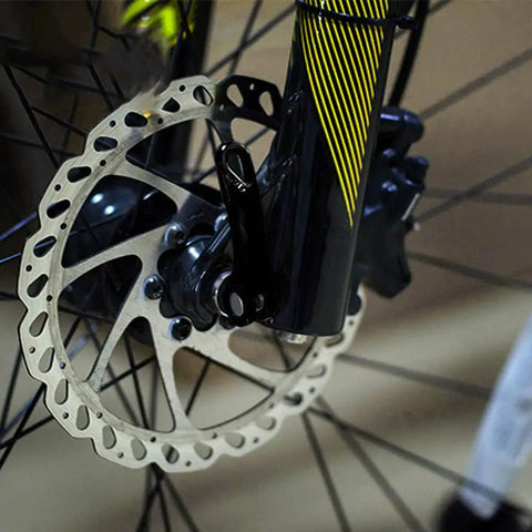 Close-up of a black quick release bicycle skewer on a front wheel, showing One Pair Quick Release Bicycle Skewers Hollow Shaft Axle Set.