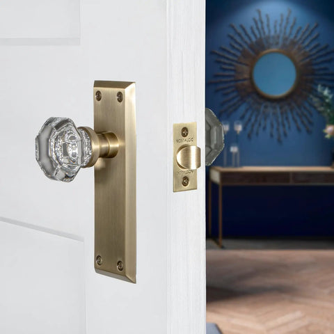Crystal Door Knob With Long Back Plate In Waldorf And New York Style Finish, solid brass with a sparkling crystal knob, door view.