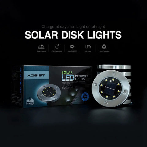 Box and single unit of Solar Ground Lights 8 Pack Waterproof White LED Disk Landscape Lights for outdoor lighting display