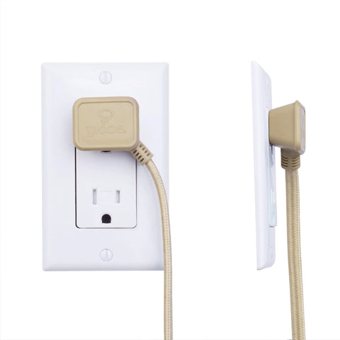 Designer Gold Fabric Extension Cord 9 Foot Length With 3 Polarized Outlets Right Angle Plug 125 Volt Patent Pending plugged into wall.