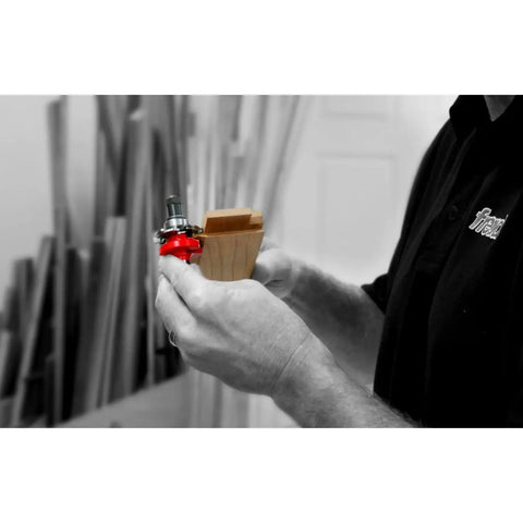 Person holding Pro Grade Workhorse Adjustable Rail And Stile Bit Round Over Bead with TiCo Hi Density Carbide for woodworking