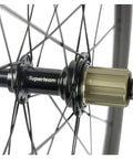 Close-up of hub on Carbon Fiber Wheelset 38mm And 23mm Rim Depths 700c Clincher Front And Rear Road Bike Wheels With Basalt Brake Surface