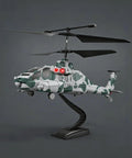 Camouflage RC Helicopter With Military Look, 2.4G 3.5CH on stand, showing missile launch feature and red accent lights.