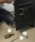 Man assembling a cabinet with Four Pack White Nylon Furniture Casters Wheels For Drawers And File Cabinets No Squeak Glide