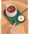 Portable Digital Cup Warmer With Three Heat Settings Hits The Spot Every Time Keeps Your Daily Brew Steaming Hot Sleek Coaster For Office Desk Dorm Rooms on wooden surface with mug and digital display.