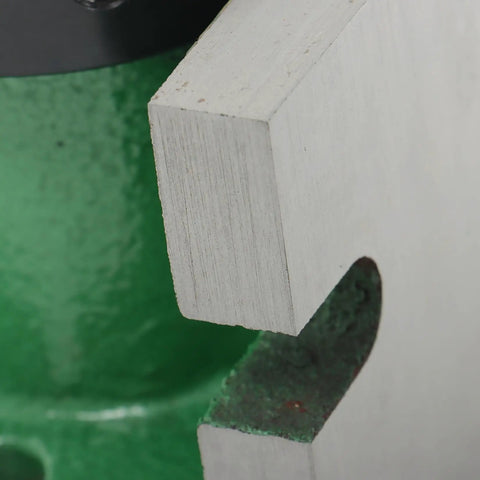 Close-up of Dual Orientation 5C Collet Fixture Holder 225-202B showing edge and green metal base for precision clamping.