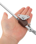 Person holding a gas strut hinge component from Two Pack Gas Struts For Cabinets With Hydraulic Lift Hinges Durable Iron Supports