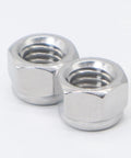Built Tough And Top Shelf Quality M8 X 1.25mm Nylon Insert Lock Nuts Crafted From Durable 304 Stainless Steel These 50 Piece Metric Self Locking Nylock Hex Nuts Deliver Ironclad Holding Power Without Any Sloppy Play For Quick Garage Fixes - close-up of two shiny stainless steel nuts.