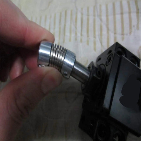 Rock Solid Flexible Shaft Coupler Built With Zinc Alloy And Spring Steel Jaw For 3D Printer Motors in hand ready for assembly.