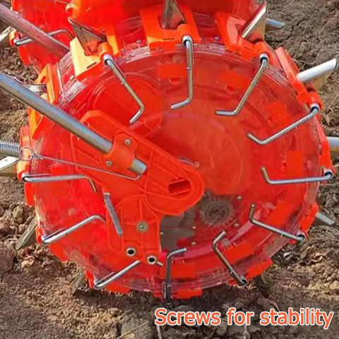 Close-up of Double Row Hand Push Garden Seeder With Nine Openings showing screws for stability on soil.