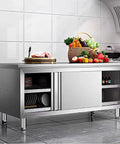 Built Tough Heavy Duty Prep Workbench With Sliding Doors Rust Resistant Stainless Steel Kitchen Table showcasing food and storage.