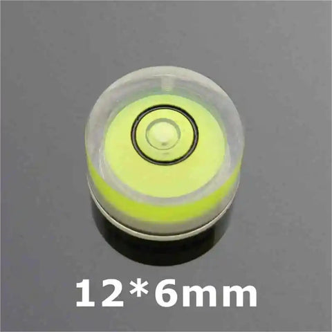 100 pcs Multisize Circular Spirit Level Bubble Level in yellow and clear, size 12*6mm for precise leveling.