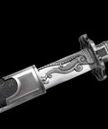 Hand Forged Qing Dynasty Dao Sword With High Manganese Steel Blade and Alloy Fittings, close-up of decorative hilt and scabbard