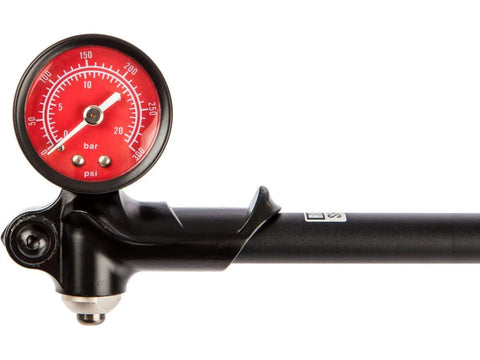 RockShox high-pressure fork/shock pump, side view with red gauge and black body, 300 psi max