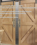 Heavy Duty Sliding Barn Door Pull Handle Bronze Set With Large Rustic Two Sided Design installed on wooden barn doors