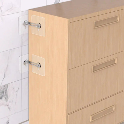 4 Piece Furniture Anti Tip Kit With Adhesive Wall Anchors For Home Use No Fuss Install Sturdy Stainless Steel And Acrylic Materials To Secure TVs And Heavy Furniture From Tip Overs. Adhesive anti-tip brackets securing a wooden dresser to a wall