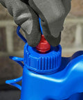 Gloved hand opening cap of All Purpose Bug And Germ Killer Insect Spray 1 Gallon For Indoor Use Keeps Bugs Gone Fast With Up To 12 Months