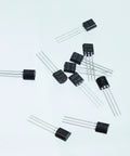 Scattered transistors from the Assorted TO92 Transistor Kit With 840 Pieces, 24 Values, NPN And PNP Bipolar Transistors For DIY Projects And Circuit Design