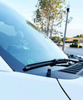 Antenna Delete Cap For Ford F Series Trucks And Bronco installed on a white Ford F150 windshield base, showcasing a clean low-profile design.