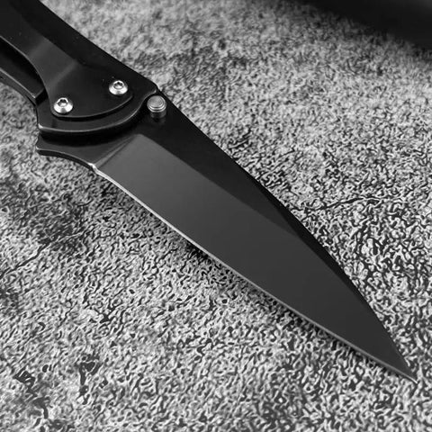 Close-up of 7 Inch Folding Pocket Knife With 8C13Mov Stainless Steel Blade and Beater Proof 420 Handle featuring a sharp blade.