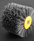 Close-up of Wire Brush Wheel For Burnishing And Polishing, 240 grit, 19mm center, 120mm diameter, black finish, side view