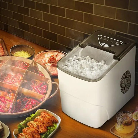Solid Countertop Automatic Ice Maker For Kitchens Or Game Rooms Producing Fast Crystal Clear Cubes In Minutes With Low Key Push Button Controls and Stress Free Operation Perfect For Weekend Hangouts And Tailgate Party Vibes with ice cubes beside food.
