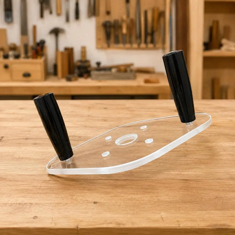 Clear Acrylic Router Base Plate With Reinforced Dual Handles For Compact Routers Rock Solid Stability And Smooth Sailing Cuts For Fine Woodworking Enthusiasts Knockout Clarity on a wooden workbench.